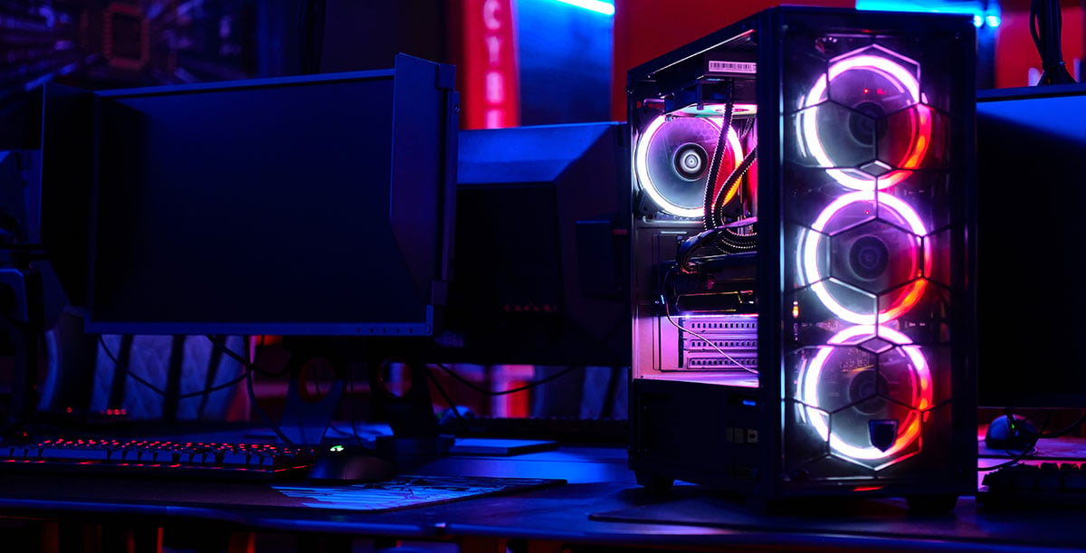 computer on with LED fans on the desk