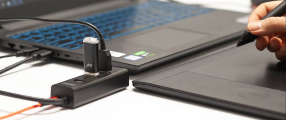 Laptop, graphics tablet and USB hub with a USB flash drive connected